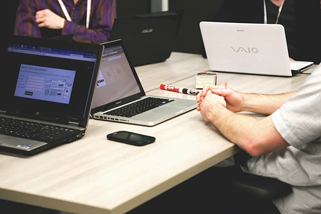 business meeting over laptops